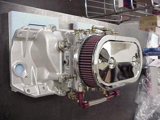 Carburetor And Intake Manifold On Work Bench
